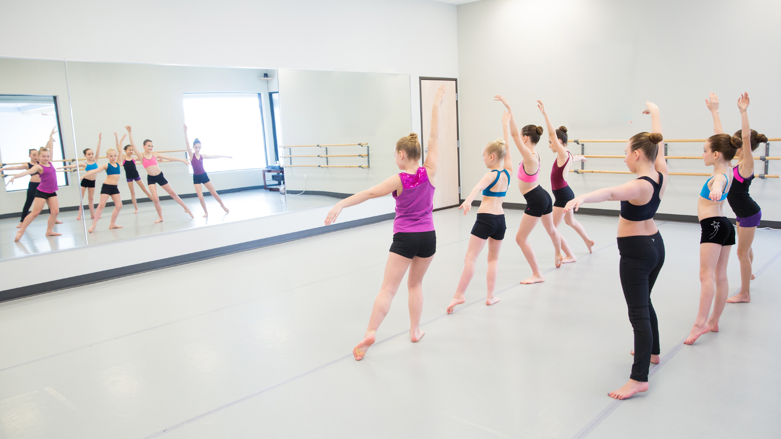 Seven dancers practicing classical jazz syllabus